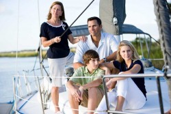 Family on a sail boat wearing resort wear